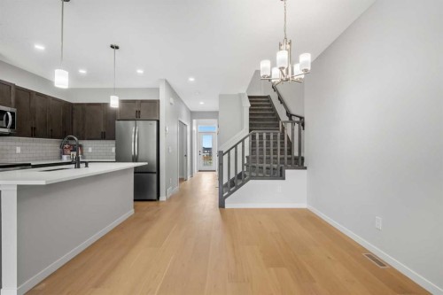 209 Bridgeport Gate North, Chestermere, AB - Indoor Photo Showing Kitchen With Upgraded Kitchen