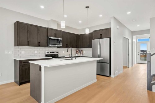 209 Bridgeport Gate North, Chestermere, AB - Indoor Photo Showing Kitchen With Upgraded Kitchen
