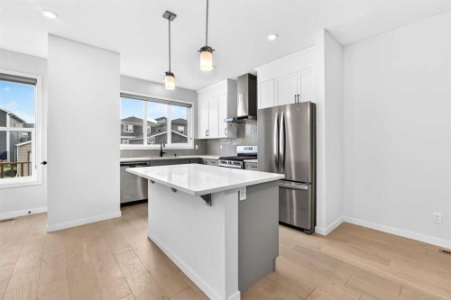 113 Midtown Close Sw, Airdrie, AB - Indoor Photo Showing Kitchen With Stainless Steel Kitchen With Upgraded Kitchen