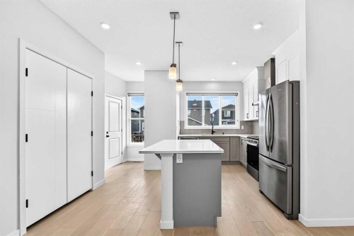 113 Midtown Close Sw, Airdrie, AB - Indoor Photo Showing Kitchen With Stainless Steel Kitchen With Upgraded Kitchen
