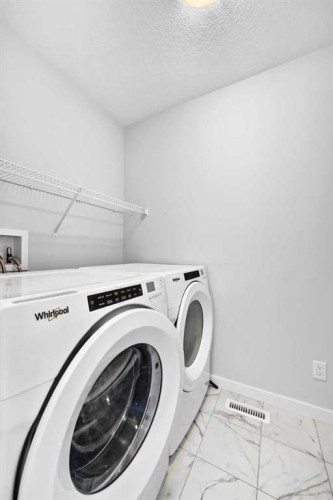 113 Midtown Close Sw, Airdrie, AB - Indoor Photo Showing Laundry Room