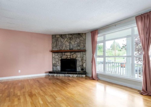 7 Lake Sylvan Close Se, Calgary, AB - Indoor Photo Showing Living Room With Fireplace
