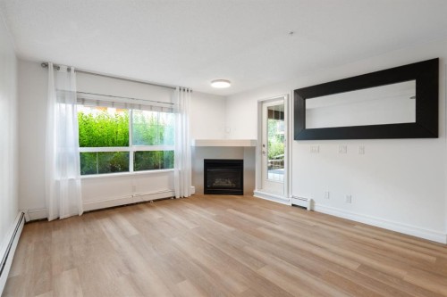 120-25 Richard Place Sw, Calgary, AB - Indoor Photo Showing Living Room With Fireplace