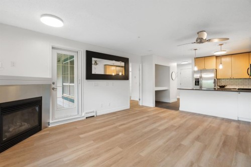 120-25 Richard Place Sw, Calgary, AB - Indoor With Fireplace