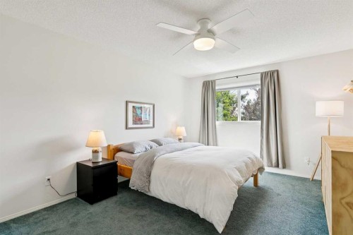 98 River Rock Way Se, Calgary, AB - Indoor Photo Showing Bedroom
