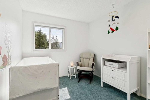 98 River Rock Way Se, Calgary, AB - Indoor Photo Showing Bedroom