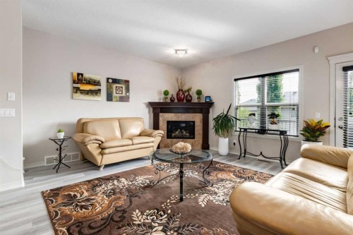 202 Silverado Bank Circle Sw, Calgary, AB - Indoor Photo Showing Living Room With Fireplace