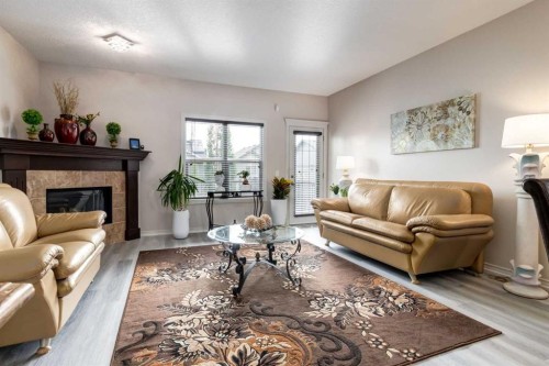 202 Silverado Bank Circle Sw, Calgary, AB - Indoor Photo Showing Living Room With Fireplace