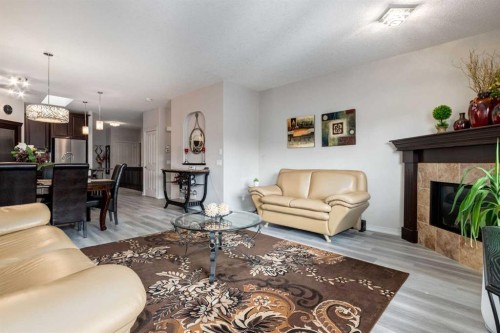 202 Silverado Bank Circle Sw, Calgary, AB - Indoor Photo Showing Living Room With Fireplace