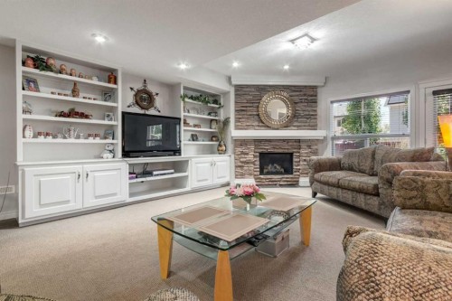 202 Silverado Bank Circle Sw, Calgary, AB - Indoor Photo Showing Living Room With Fireplace