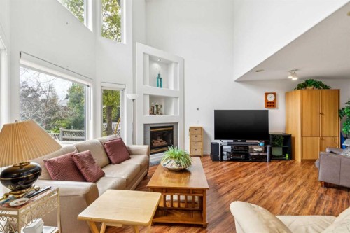 23 Sierra Nevada Close Sw, Calgary, AB - Indoor Photo Showing Living Room With Fireplace