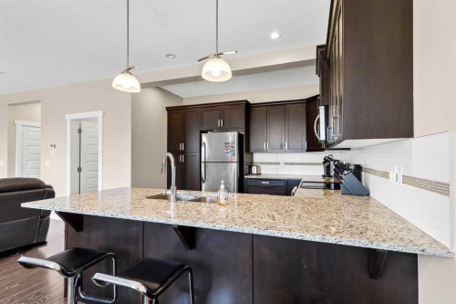1701-1086 Williamstown Boulevard Nw, Airdrie, AB - Indoor Photo Showing Kitchen With Double Sink With Upgraded Kitchen