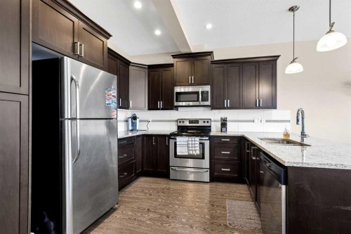 1701-1086 Williamstown Boulevard Nw, Airdrie, AB - Indoor Photo Showing Kitchen With Upgraded Kitchen