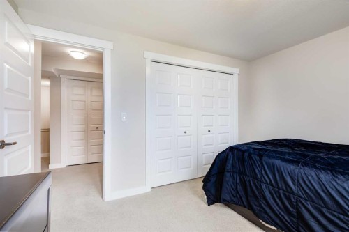 1701-1086 Williamstown Boulevard Nw, Airdrie, AB - Indoor Photo Showing Bedroom