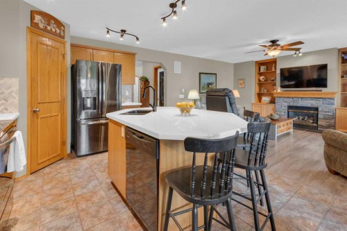 264 Tuscany Ridge View Nw, Calgary, AB - Indoor Photo Showing Other Room With Fireplace