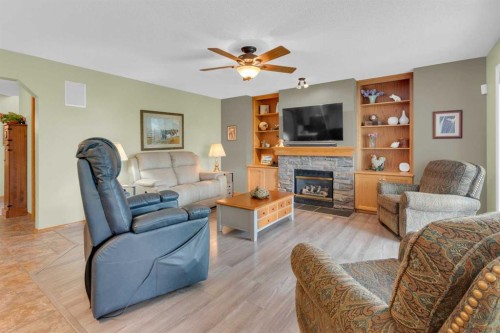 264 Tuscany Ridge View Nw, Calgary, AB - Indoor Photo Showing Living Room With Fireplace