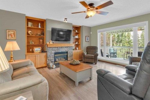 264 Tuscany Ridge View Nw, Calgary, AB - Indoor Photo Showing Living Room With Fireplace