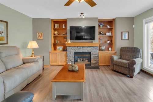 264 Tuscany Ridge View Nw, Calgary, AB - Indoor Photo Showing Living Room With Fireplace