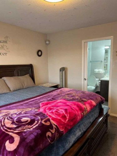 50 Tarawood Lane Ne, Calgary, AB - Indoor Photo Showing Bedroom
