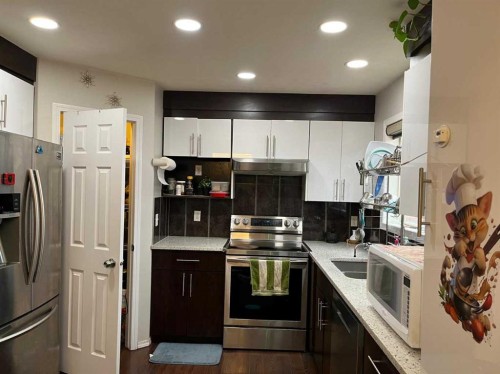 50 Tarawood Lane Ne, Calgary, AB - Indoor Photo Showing Kitchen With Double Sink