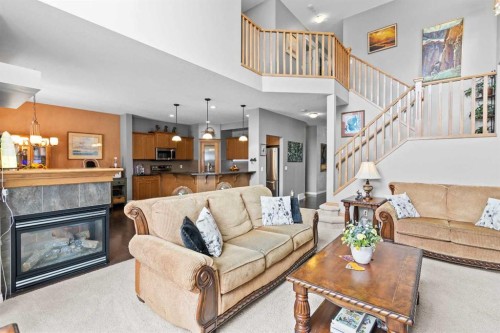 22 Westfall Drive, Okotoks, AB - Indoor Photo Showing Living Room With Fireplace