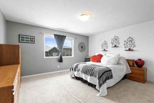 22 Westfall Drive, Okotoks, AB - Indoor Photo Showing Bedroom
