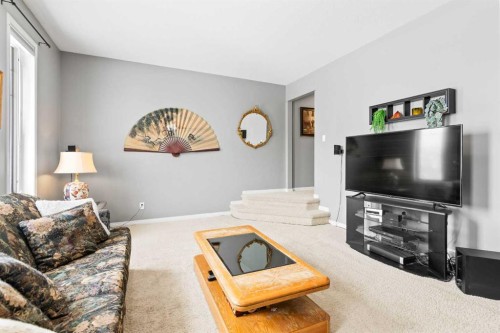 22 Westfall Drive, Okotoks, AB - Indoor Photo Showing Living Room