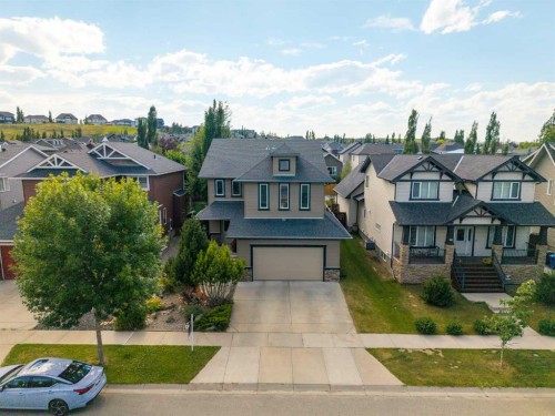 22 Westfall Drive, Okotoks, AB - Outdoor With Facade
