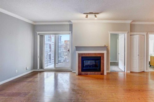 343-333 Riverfront Avenue Se, Calgary, AB - Indoor Photo Showing Living Room With Fireplace