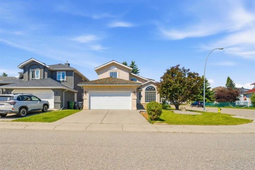 71 Woodpark Close Sw, Calgary, AB - Outdoor With Facade
