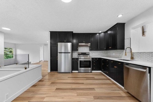 1091 Berkley Drive Nw, Calgary, AB - Indoor Photo Showing Kitchen With Stainless Steel Kitchen With Upgraded Kitchen