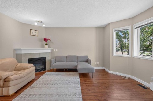 118 Royal Birch Villas Nw, Calgary, AB - Indoor Photo Showing Living Room With Fireplace