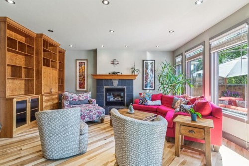 2033 Bowness Road Nw, Calgary, AB - Indoor Photo Showing Living Room With Fireplace