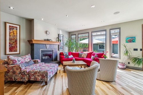2033 Bowness Road Nw, Calgary, AB - Indoor Photo Showing Living Room With Fireplace
