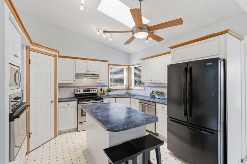 58 Mountain Park Drive Se, Calgary, AB - Indoor Photo Showing Kitchen With Double Sink