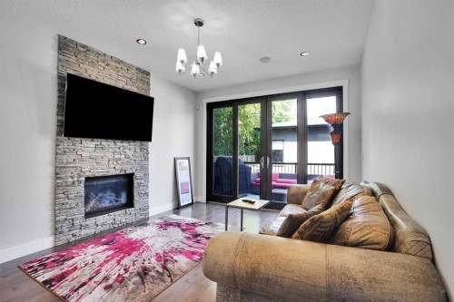 1018 20 Avenue Se, Calgary, AB - Indoor Photo Showing Living Room With Fireplace