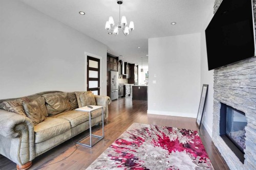 1018 20 Avenue Se, Calgary, AB - Indoor Photo Showing Living Room With Fireplace