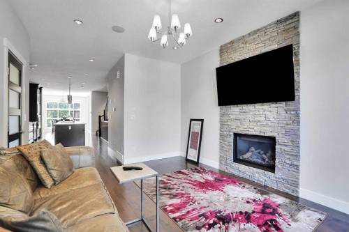 1018 20 Avenue Se, Calgary, AB - Indoor Photo Showing Living Room With Fireplace