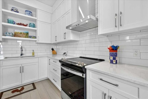 1066 Creekside Boulevard Sw, Calgary, AB - Indoor Photo Showing Kitchen With Upgraded Kitchen