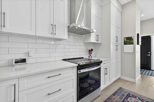 1066 Creekside Boulevard Sw, Calgary, AB - Indoor Photo Showing Kitchen With Upgraded Kitchen