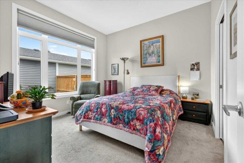 1066 Creekside Boulevard Sw, Calgary, AB - Indoor Photo Showing Bedroom