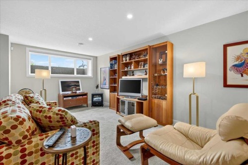 1066 Creekside Boulevard Sw, Calgary, AB - Indoor Photo Showing Living Room