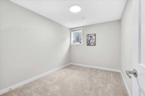 1066 Creekside Boulevard Sw, Calgary, AB - Indoor Photo Showing Other Room