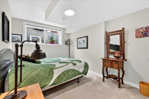 1066 Creekside Boulevard Sw, Calgary, AB - Indoor Photo Showing Bedroom