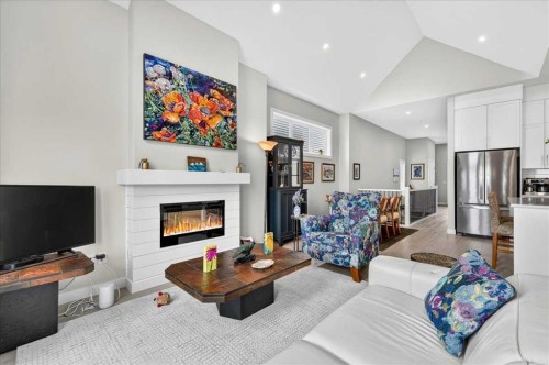 1066 Creekside Boulevard Sw, Calgary, AB - Indoor Photo Showing Living Room With Fireplace