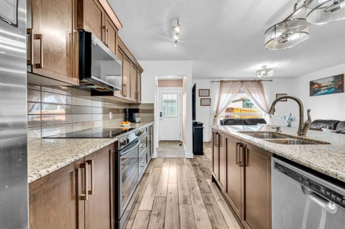 1444 Legacy Circle Se, Calgary, AB - Indoor Photo Showing Kitchen With Stainless Steel Kitchen With Double Sink With Upgraded Kitchen