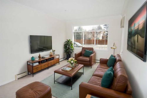 108-9449 19 Street Sw, Calgary, AB - Indoor Photo Showing Living Room