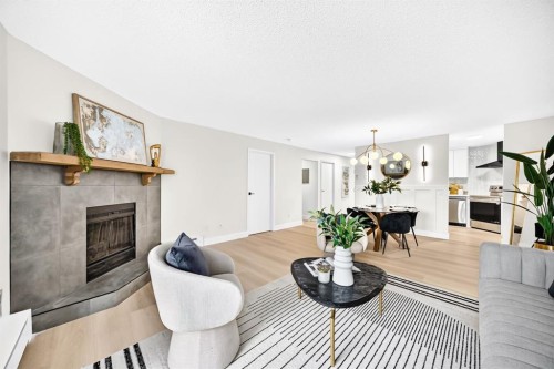 3204-80 Glamis Drive Sw, Calgary, AB - Indoor Photo Showing Living Room With Fireplace