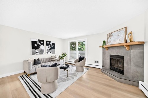3204-80 Glamis Drive Sw, Calgary, AB - Indoor Photo Showing Living Room With Fireplace