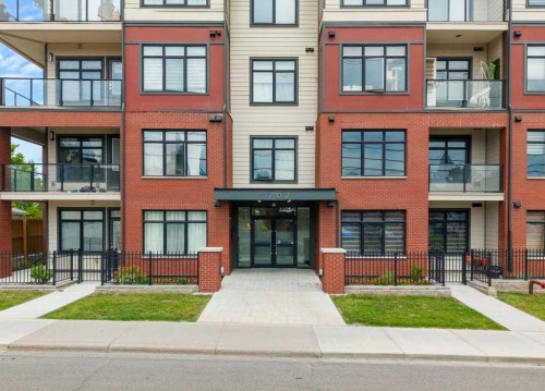 306-1702 17 Avenue Sw, Calgary, AB - Outdoor With Balcony With Facade